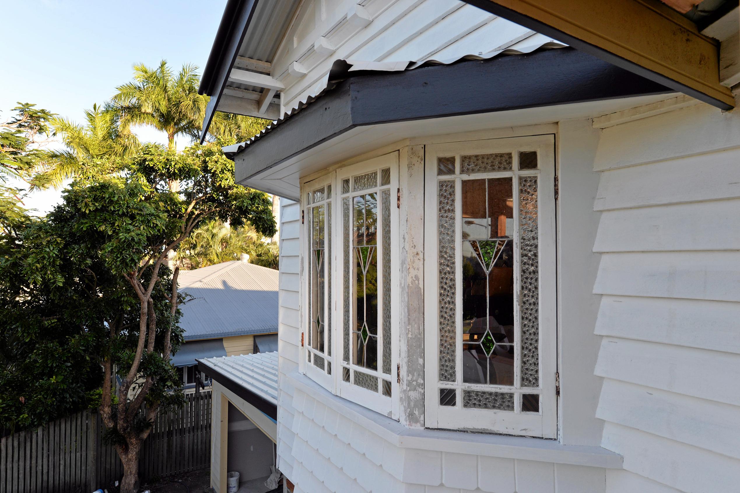 Mackay house-flippers Madison Strutynski and Michael Cotter at their Hunter St, West Mackay property. Picture: Stuart Quinn