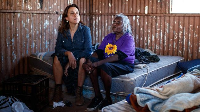 Indigenous filmmaker and Yes campaigner Rachel Perkins, left, with Aunty Felicity Hayes in one of the dirt-poor camps outside Alice Springs. Picture Matt Turner