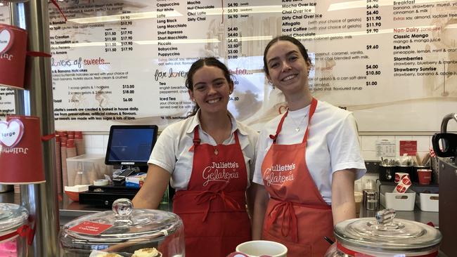 Ella Riethmuller, 23, and Denby O'Keefe, 18, at Juliette's Gelateria in Townsville are planning on closing early ahead of Cyclone Kirrily.