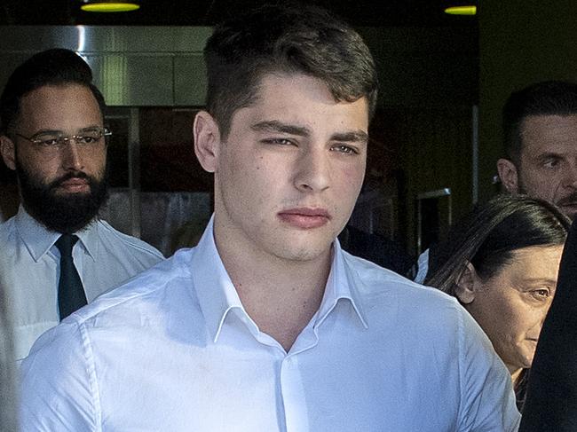 ADELAIDE, AUSTRALIA - NewsWire Photos JULY 16, 2024: Marco Yandle,20, leaves the Supreme Court with his lawyer, Defence lawyer Stephen Ey  and family  who is charged with assisting an offender - his father - who killed homeless man Steven Murphy on their property in February 2023.Picture: NewsWire / Mark Brake