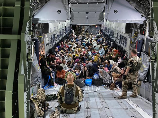 Evacuees from Kabul sit inside a military aircraft as they arrive at Tashkent Airport in Uzbekistan last week. Picture: Handout/Bundeswehr via Getty Images