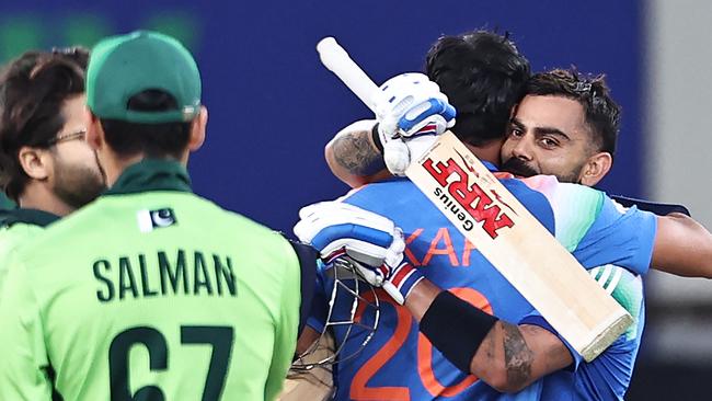 Kohli and Axar Patel celebrate beating Pakistan in the Champions Trophy. (Photo by FADEL SENNA / AFP)