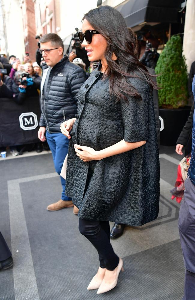 Meghan cradles her ever-growing bump. Picture: Skyler2018 / BACKGRID