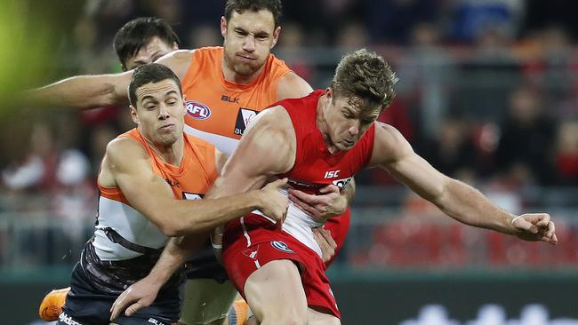 Josh Kelly and Shane Mumford tackle Luke Parker. Picture: Phil Hillyard