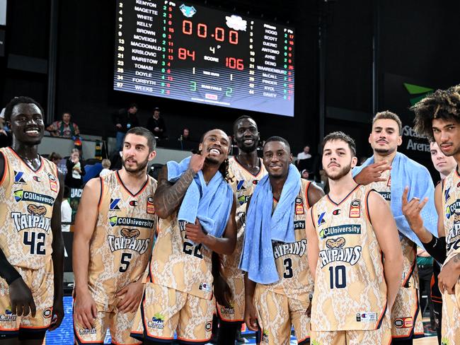 The Taipans celebrate their upset win over Tasmania in their round one NBL match contest. Picture: Steve Bell/Getty Images