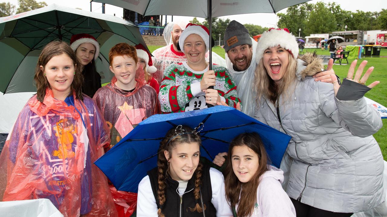 Sealink Carols by Candlelight at Elder Park - The White Family braves the weather. Picture: Brett Hartwig