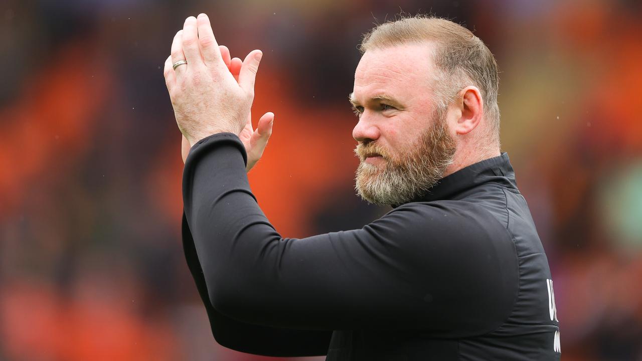 BLACKPOOL, ENGLAND - APRIL 30: Wayne Rooney, manager of Derby County, applauds the visiting support after the Sky Bet Championship match between Blackpool and Derby County at Bloomfield Road on April 30, 2022 in Blackpool, England. (Photo by James Gill/Getty Images)