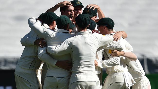 Australian players celebrate their special Boxing Day Test victory.