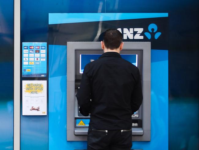 A customer uses an automated teller machine (ATM) outside an Australia & New Zealand Banking Group Ltd. (ANZ) branch in Sydney, Australia, on Wednesday, Aug. 31, 2011. Australia & New Zealand Banking Group Ltd. is considering buying Japan's Aozora Bank Ltd. as part of a plan to expand in Asia and broaden its funding sources, according to a person familiar with the matter. Photographer: Ian Waldie/Bloomberg