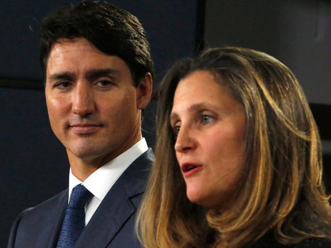 (FILES) Canada's Prime Minister Justin Trudeau (L) and Minister of Foreign Affairs Chrystia Freeland (R) speak at a press conference to announce the new trade pact with Canada, the United States, and Mexico in Ottawa, October 1, 2018. Deputy Prime Minister Chrystia Freeland in a surprise announcement on December 16, 2024, quit over disagreements with Justin Trudeau on Canada's response to US President-elect Donald Trump's tariff threats. (Photo by PATRICK DOYLE / AFP)