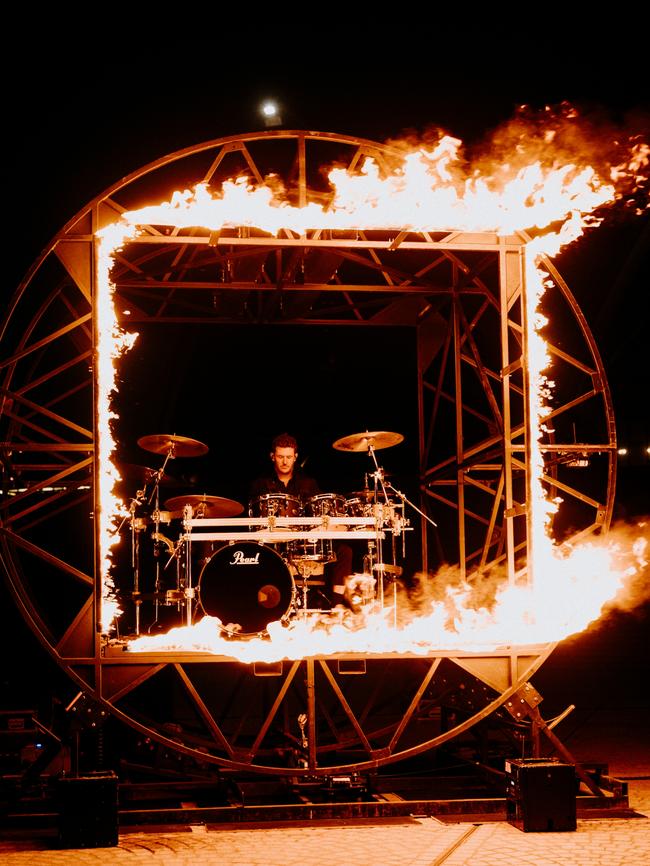 Parkway Drive drummer Ben Gordon pictured with his flaming drum kit, dubbed the ‘cage of death’. Picture: Third Eye Visuals