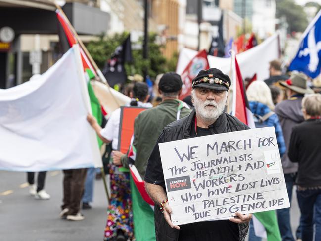 Pat Menz holds a pro-Palestine sign in the Toowoomba Labour Day march, Saturday, May 4, 2024. Picture: Kevin Farmer