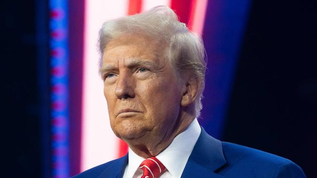 PHOENIX, ARIZONA - DECEMBER 22: U.S. President-elect Donald Trump looks on during Turning Point USA's AmericaFest at the Phoenix Convention Center on December 22, 2024 in Phoenix, Arizona. The annual four day conference geared toward energizing and connecting conservative youth hosts some of the country's leading conservative politicians and activists.   Rebecca Noble/Getty Images/AFP (Photo by Rebecca Noble / GETTY IMAGES NORTH AMERICA / Getty Images via AFP)