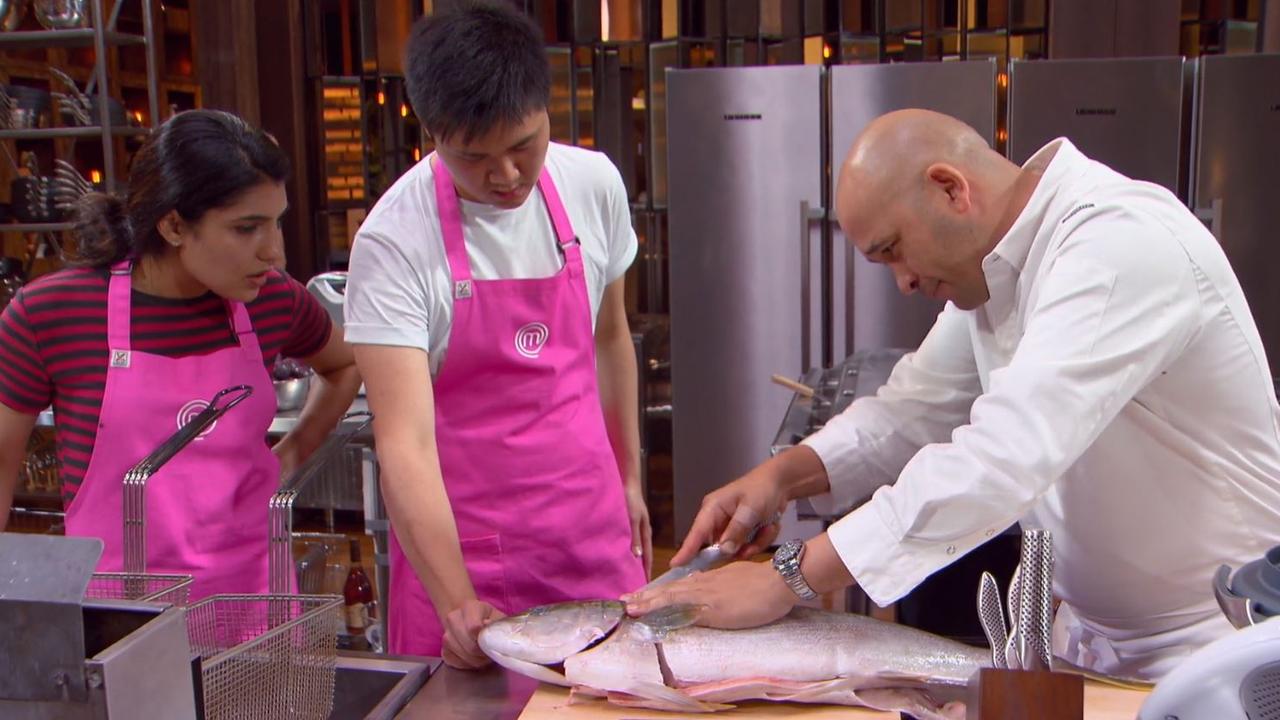 Chef Adam teaches Eric how to fillet a fish. Picture: Channel 10