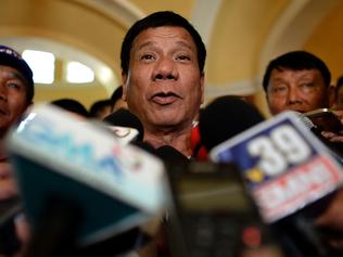 (FILES) This file photo taken on March 2, 2016, shows Davao City Mayor and Presidential Candidate Rodrigo Duterte speaks to reporters during his campaign sortie in Lingayen, Pangasinan, north of Manila. Leading Philippine presidential candidate Rodrigo Duterte, whose campaign promises a ruthless war on crime, was condemned on April 17, 2016 after a video surfaced of him apparently joking about a murdered Australian rape victim. / AFP PHOTO / NOEL CELIS