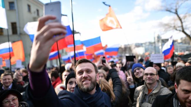 Taking a selfie at a memorial march marking the one-year anniversary of the assassination of Russian politician Boris Nemtsov in central Moscow, on February 27, 2016. Picture: AFP