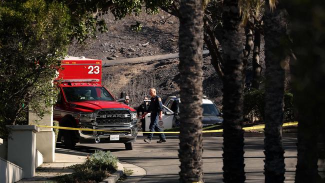 Law enforcement officials investigate a potential ignition point of the Palisades Fire near the Skull Rock trailhead. Picture: Getty Images via AFP)