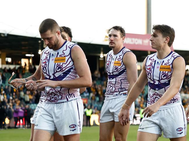 LAUNCESTON, AUSTRALIA - JULY 13: Dockers players look dejected after a loss during the 2024 AFL Round 18 match between the Hawthorn Hawks and the Fremantle Dockers at the UTAS Stadium on July 13, 2024 in Launceston, Australia. (Photo by Michael Willson/AFL Photos via Getty Images)