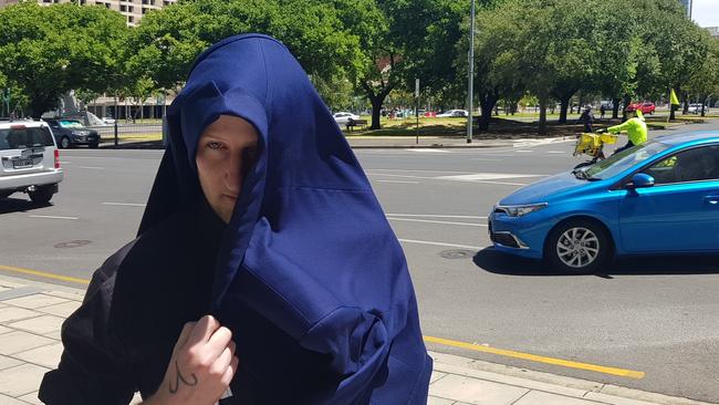 Scammer Christopher Lloyd George outside the Adelaide Magistrates Court. Picture: Sean Fewster.