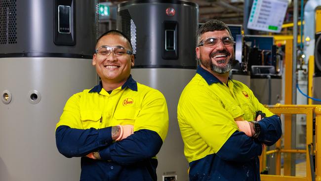Tee Nget and Mohammed Assaad working on the heat pump water heater production line at Rheem Australia in Rydalmere. Picture: Justin Lloyd