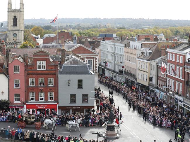 Crowds cheer Jack Brooksbank and Princess Eugenie as they leave in a carriage following their wedding ceremony. Picture: AP