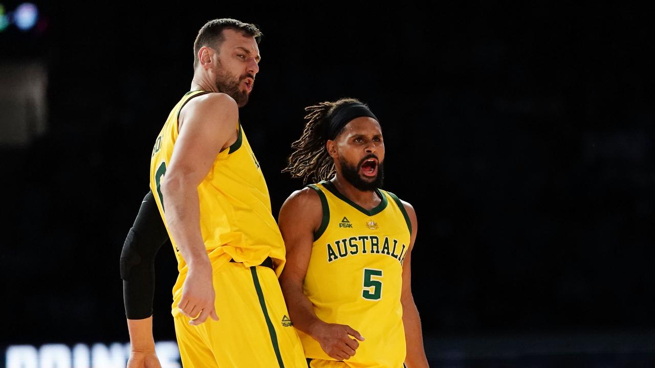 Patty Mills with Andrew Bogut. AAP Image/Scott Barbour.