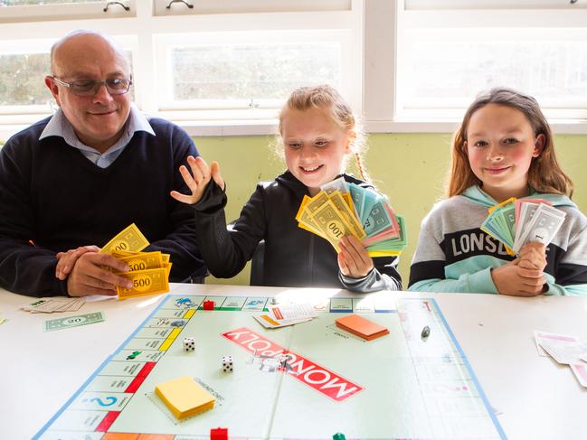 North Epping Public School teacher Keith Barnett, pictured with students Imogen and Sophie, went on a study trip to learn better ways of teaching maths. Picture: AAP