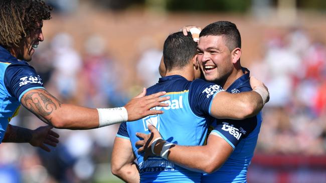 Titans fullback Michael Gordon celebrates scoring a try with Ashley Taylor.