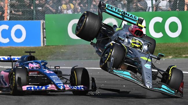 Mercedes' British driver Lewis Hamilton (R) collides with Alpine's Spanish driver Fernando Alonso