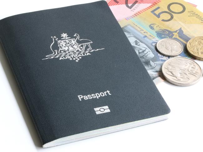 Australian passport with some money on white background.