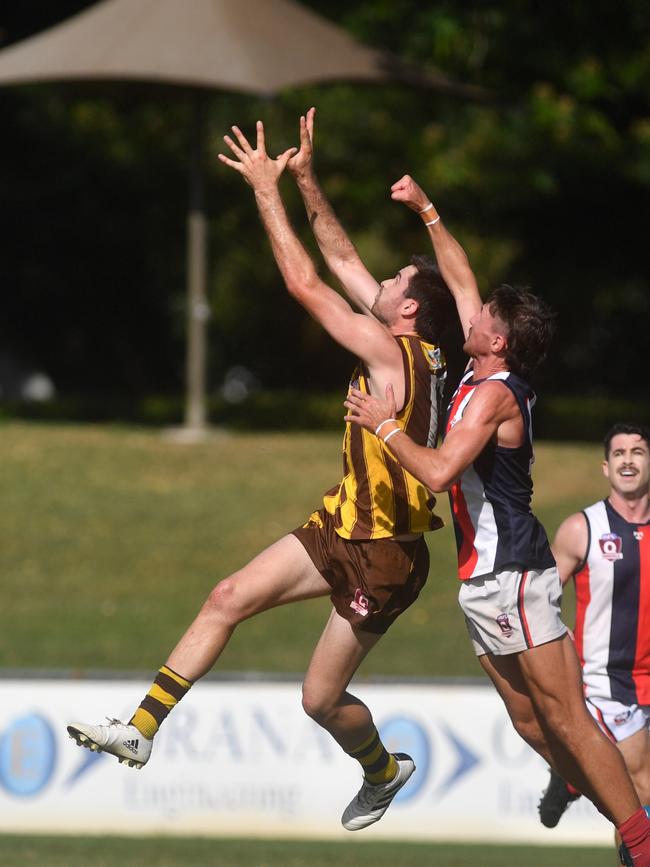 Townsville AFL. Curra Swans against University Hawks at Riverway. Hawks John Dempsey and Swans Mitchell Dennis. Picture: Evan Morgan