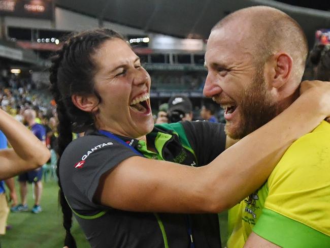 Charlotte Caslick of Australia celebrates with James Stannard after the men's team won the Cup final match against South Africa during Day 3 of the Sydney 7's rugby competition at the Allianz Stadium in Sydney, Sunday, January 28, 2018.  (AAP Image/David Moir) NO ARCHIVING, EDITORIAL USE ONLY