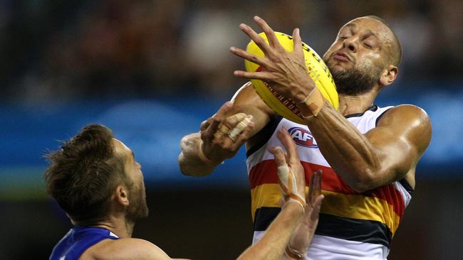 Cam Ellis-Yolmen of the Crows (right) under pressure from Jamie Macmillan of the Kangaroos. Picture: AAP Image/Hamish Blair