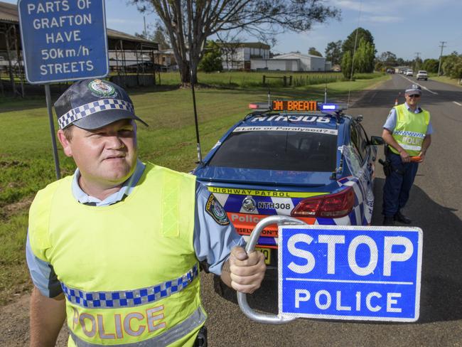 Senior constable Jeff Rainbow and Snr Constable Scott English from Grafton Highway patrol perform random breath testing on Armidale Road. Photo Adam Hourigan / The Daily Examiner