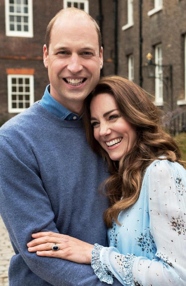 The couple who have been married for a decade wore blue in a nod to their engagement shoot. Picture: AFP