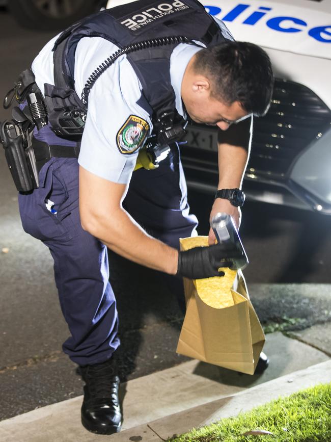 Police collect evidence on the night of the attack. Picture: Dylan Robinson