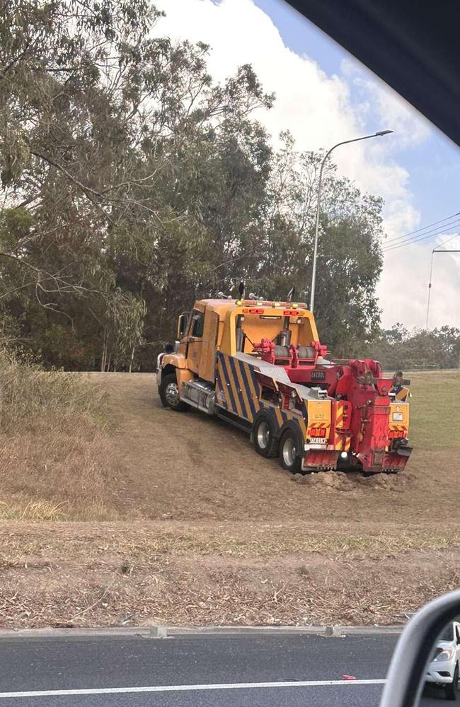 Queensland Fire and Emergency services called to truck crash on M1 after driver fell asleep. Photo: Nathan Rogers