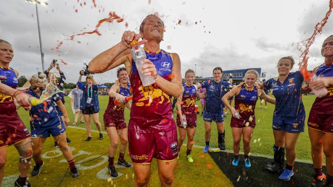 Emma Pittman of the Lions celebrates her first match with teammates after the Lions win during the AFLW round 4 match between the Brisbane Lions and the Fremantle Dockers at South Pine Sports Complex in Brisbane, Saturday, February 24, 2018. (AAP Image/Glenn Hunt)