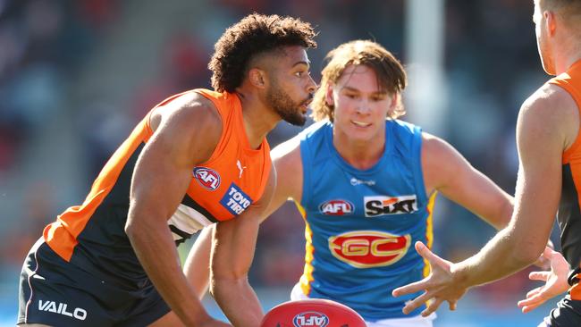 Connor Idun of the Giants finds a way past Gold Coast’s Bailey Humphrey. Picture: Mark Nolan/AFL Photos/via Getty Images