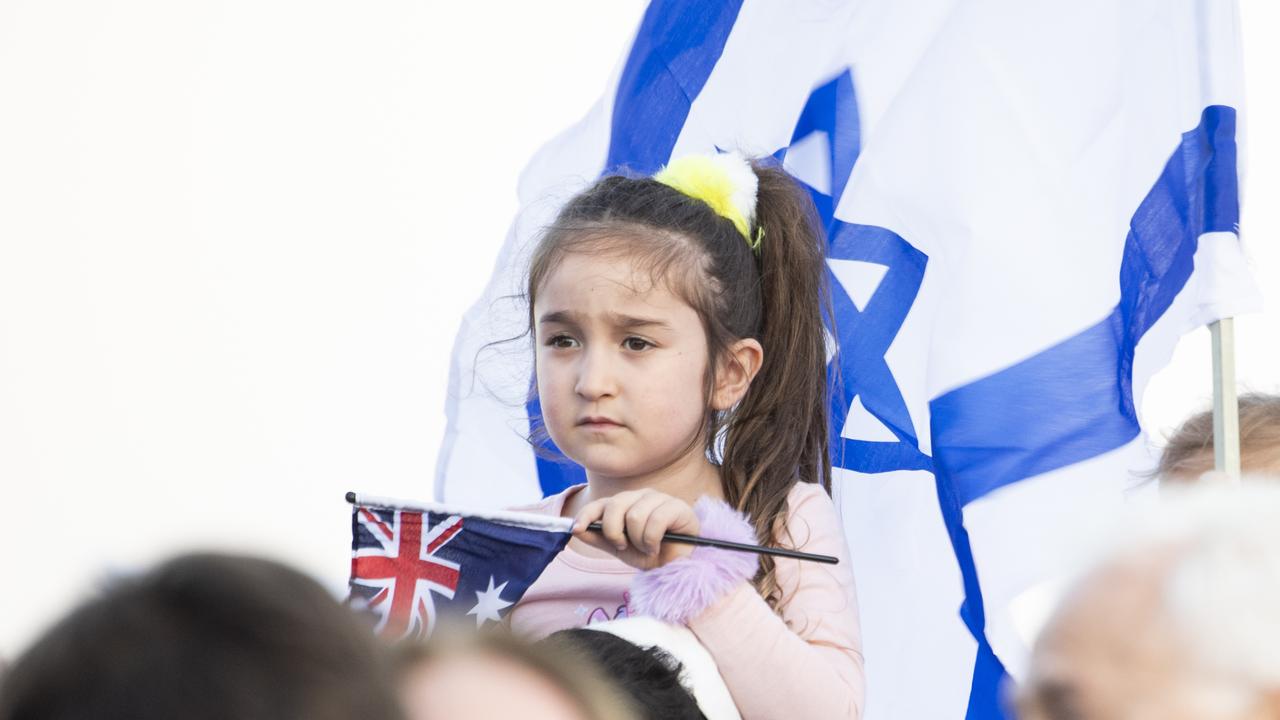 A young girl takes in the vigil. Picture: NCA NewsWIRE / Monique Harmer