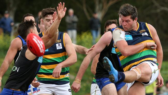 University Blues and St Kevin's do battle in the VAFA, where players are not paid. Picture: Hamish Blair