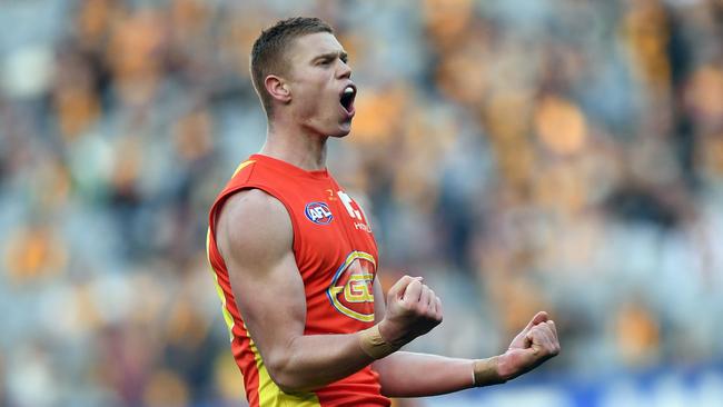 Peter Wright of the Suns reacts after kicking a goal during the Round 12 AFL match between the Hawthorn Hawks and the Gold Coast Suns at the MCG in Melbourne, Saturday, June 10, 2017. (AAP Image/Julian Smith) NO ARCHIVING, EDITORIAL USE ONLY