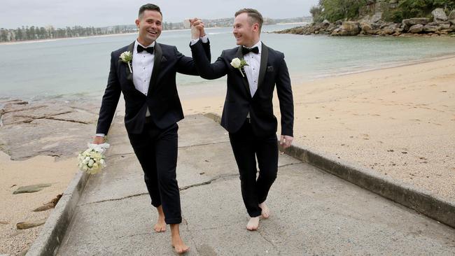 Dan Waknin and James Hanley celebrate their marriage at The Boathouse Shelly Beach. Picture: Adam Ward.