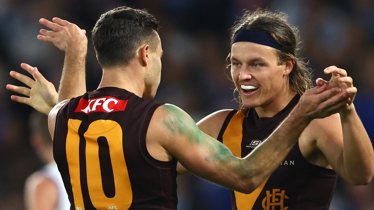 MELBOURNE, AUSTRALIA - APRIL 21: Karl Amon and Jack Ginnivan of the Hawks celebrate a goal during the round six AFL match between North Melbourne Kangaroos and Hawthorn Hawks at Marvel Stadium, on April 21, 2024, in Melbourne, Australia. (Photo by Quinn Rooney/Getty Images)