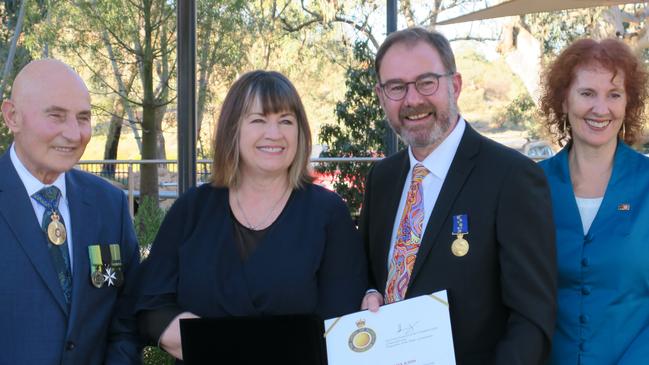 Hugh Heggie, Kristina Kidd, Steven Kidd and Ruth Jones. Steven Kidd was awarded his OAM on June 14 by Hugh Heggie at St Phillips College in Alice Springs on June 14, 2024.