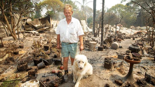 Rex Newton with his dog Charlie. Charlie and two cats survived the fire but 65 of Rex’s birds perished. Picture: Mark Stewart