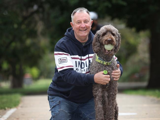 Grayham Bottomley was treated for an enlarged prostate and now problem solved. Grayham on a daily walk with his dog Molly at the park.                                                             Picture: David Caird