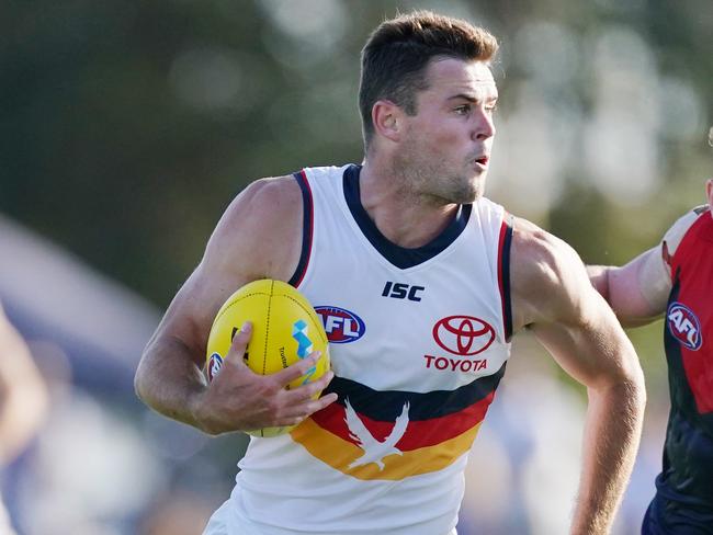 Brad Crouch of the Crows runs with the ball during the AFL Marsh Community Series pre-season match between the Melbourne Demons and Adelaide Crows at Casey Fields in Melbourne, Saturday, February 22, 2020. (AAP Image/Michael Dodge) NO ARCHIVING, EDITORIAL USE ONLY