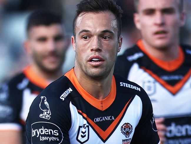 SYDNEY, AUSTRALIA - JUNE 12:  Luke Brooks of the Tigers runs with the ball during the round 14 NRL match between the Wests Tigers and the Manly Sea Eagles at Campbelltown Stadium, on June 12, 2022, in Sydney, Australia. (Photo by Matt King/Getty Images)