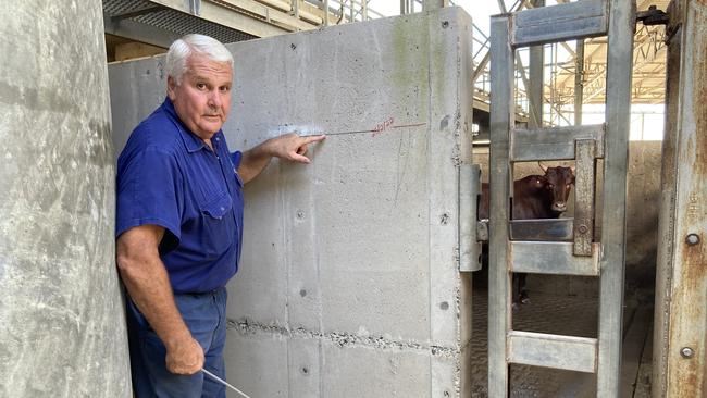 Nolan Meats director Terry Nolan shows where the February 2022 floodwaters peaked at the meatworks,